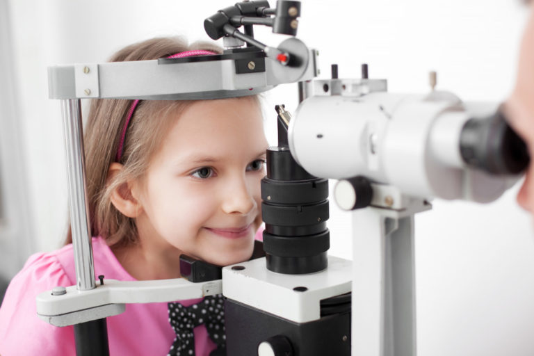 girl getting an eye check up