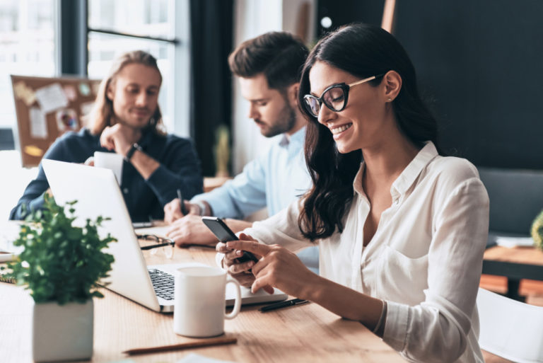 modern employees using office gadgets