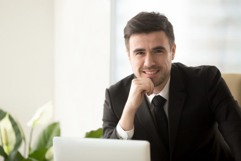 confident mature businessman in his office