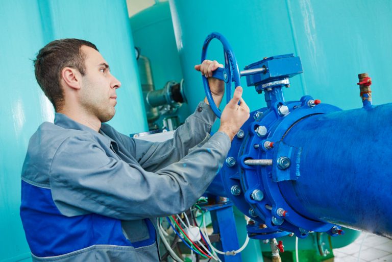 valve operator in action wearing PPE