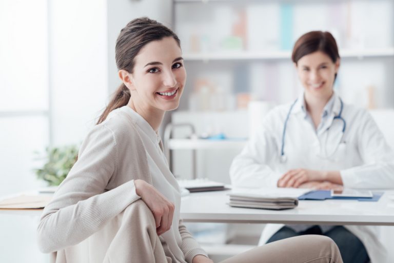 medical professional with a patient smiling